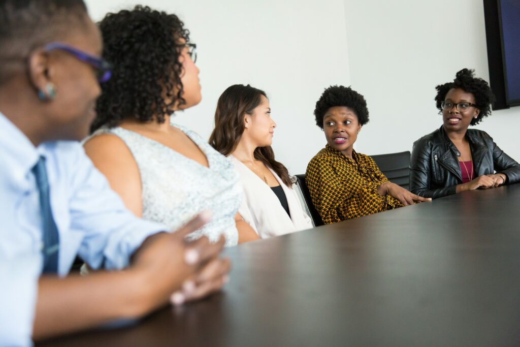 Business leaders in discussion around a boardroom table