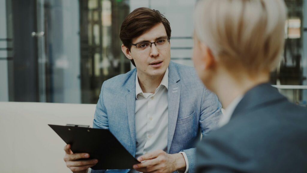 A manager listening attentively during a one-on-one conversation with a team member